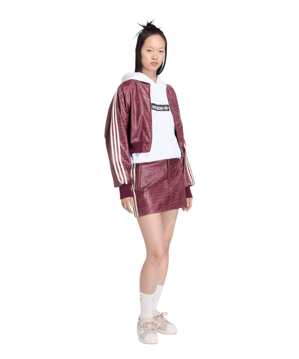 Mini-jupe en similicuir avec poches zippées en similpelle