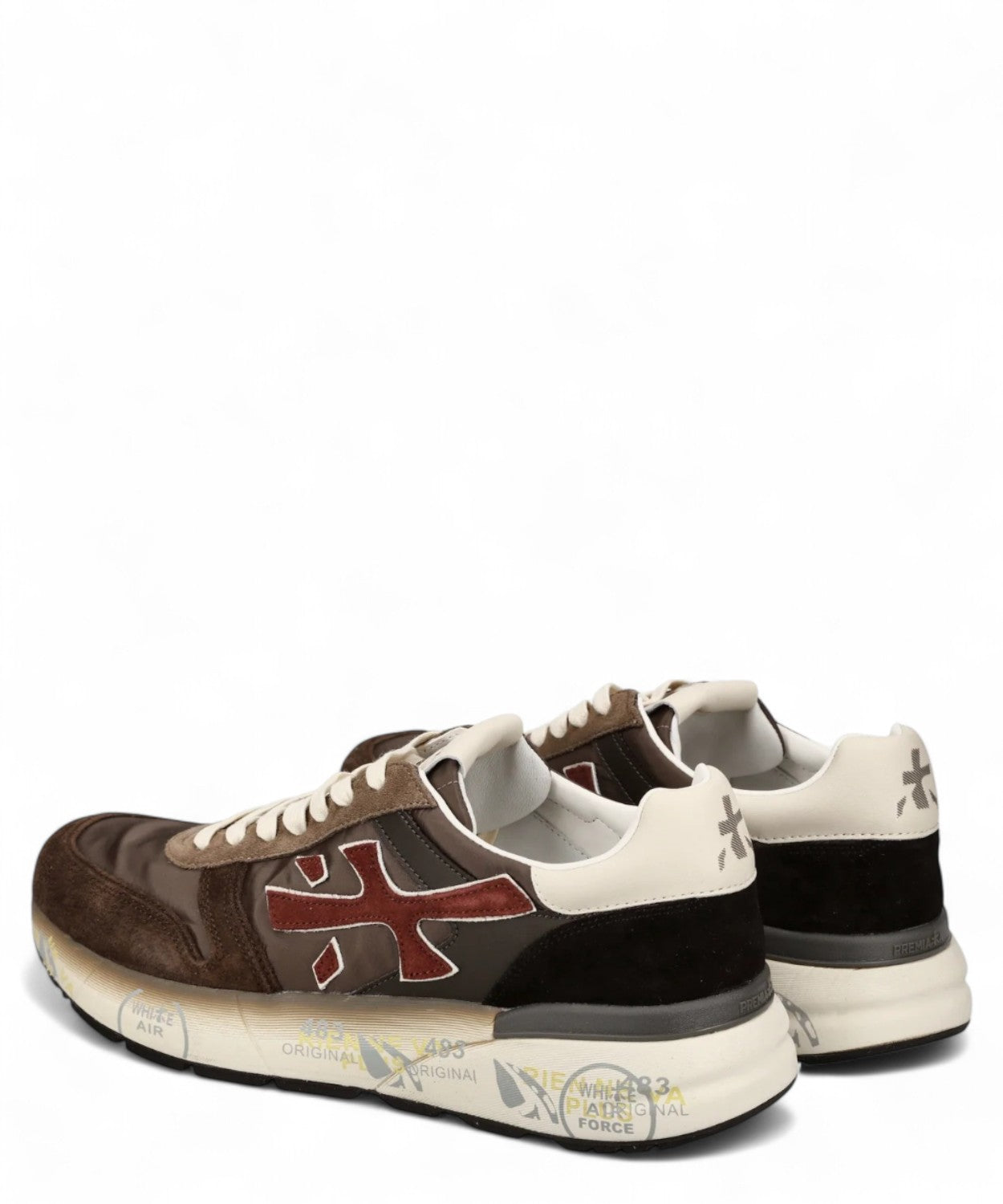 Sneakers uomo marrone Premiata MICK 7714, vista posteriore con tallone in suede nero e logo sul retro, suola con grafiche originali.